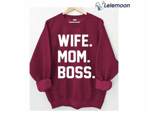 The "Wife Mom Boss" sweatshirt is a bold and empowering garment that celebrates the many roles and responsibilities of modern women. Made from high-quality materials, this sweatshirt is both comfortable and stylish. Its design features bold, eye-catching text that proclaims a message of strength and confidence. The phrase "Wife Mom Boss" is a powerful declaration of the many hats that women wear in their lives. It acknowledges the hard work and dedication that women put into their relationships, their families, and their careers. The sweatshirt is an excellent way to express your pride in these roles, and to inspire other women to do the same. Whether worn casually or dressed up, the "Wife Mom Boss" sweatshirt is sure to make a statement. It's a perfect addition to any wardrobe, and a great way to show your appreciation for the many roles that women play in our society. This sweatshirt is not just a fashionable item, but also a reminder of the importance of women's empowerment and gender equality. It's a perfect gift for the special women in your life, or for yourself as a reminder of your strength and resilience. The "Wife Mom Boss" sweatshirt is a celebration of the power and potential of women everywhere.